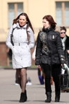Street fashion in Minsk. Spring 2011 (looks: white quilted coat, black ankle boots, black sheer tights, black jacket, black trousers)