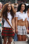 "Jamaica" Girl band (looks: white blouse, red mini tartan skirt, white blouse, checkered black and white skirt; person: Marta Zhdanyuk)