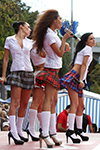 Short plaid minis and white knee-highs: a sizzling performance by the girls from the band "Jamaica"