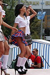 Short plaid minis and white knee-highs: a sizzling performance by the girls from the band "Jamaica"