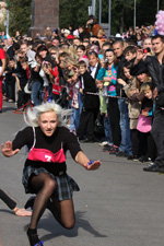 Running in heels. 2012 (looks: checkered skirt, black tights)