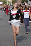Running in heels. 2012 (looks: white top, black sport jacket, grey mini skirt)