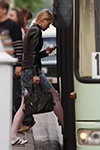 Moda en la calle en Gómel. 05/2012 (looks: trenza, bolso negro, botines blancos, , medias con banda de encaje blancas, falda vaquera azul claro corta)
