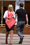 Minsk street fashion. 07/2012 (looks: blond hair, coral bag, blue skirt, nude fishnet tights, coral pumps)