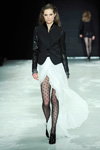 Sand show — Copenhagen Fashion Week AW13/14 (looks: black polka dot tights, black pumps, black blazer, white wrap skirt)