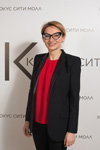 Evelina Khromtchenko. Fashion Day / Crocus (looks: black pantsuit, red top)