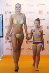 Extreme Intimo show — Lingerie-Expo 2013 (looks: multicolored swimsuit with ties, blond hair)