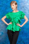 Lookbook PODOLYAN SS 2013 (ubrania i obraz: top zielony, spodnie czarne)