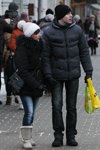 Gomel street fashion. 01/2013 (looks: white knit cap with pom-pom, black coat, black gloves, sky blue jeans)