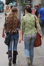 Gomel street fashion. 05/2013 (looks: , brown wool leg warmers with pom-pom, sky blue jeans, brown bag)