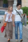 Street fashion in Minsk. Hot May 2013 (looks: white printed top, , orange bag, orange ballerinas, white printed t-shirt, sky blue jeans)