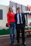 Photofact. Natalia Vodianova (looks: red blazer, blue jeans, black clutch, black ankle boots, black men's suit, black tie, black dress boot; person: Natalia Vodianova)