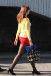 Minsk street fashion. 04/2014 (looks: yellow jumper, red mini skirt, black pumps, black sheer tights, bag with diamond pattern)