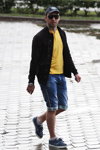 Minsk street fashion. 06/2014 (looks: yellow t-shirt, black baseball cap, blue denim shorts, white socks, blue boots, black jacket)