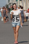 Minsk street fashion. 08/2015 (looks: white printed top, sky blue ripped denim shorts, )