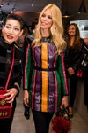 Claudia Schiffer. MCM (looks: red bag, blond hair, striped mini multicolored leather dress; person: Claudia Schiffer)