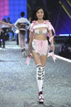 Xiao Wen Ju. Pink Nation — Victoria's Secret Fashion Show 2016 (looks: white printed overknees, pink shorts, grey bra)