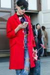 Street fashion. 15/03/2016 — Mercedes-Benz Fashion Week Russia (looks: red coat, sky blue ripped jeans)