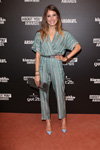 Awards ceremony. ABOUT YOU (looks: sky blue pumps, grey clutch, striped jumpsuit)