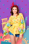 Alena Spodynyuk. Alena Spodynyuk. Photoshoot — Miss Universe Ukraine 2016 (looks: yellow printed blouse, , blue denim shorts)