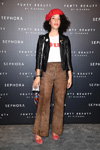 France. Guests. Fenty Beauty by Rihanna (looks: red beret, white top with slogan, black leather jacket, brown trousers)