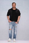 Igor Chapurin. Chapurin for Finn Flare show — MBFWRussia fw17/18 (looks: black shirt, black t-shirt, sky blue ripped jeans)