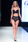 Glora Lingerie lingerie show — Riga Fashion Week SS18 (looks: black bra, black briefs, black pumps)