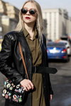 Street fashion. 03/2017 — MBFWRussia fw17/18 (looks: Sunglasses, black leather coat, blond hair, black bag, black belt, khaki dress)