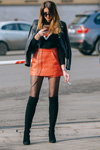 Street fashion. 03/2017 — MBFWRussia fw17/18 (looks: suede black boots, black sheer tights, coral mini leather skirt, black leather biker jacket)