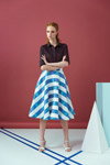 Lookbook ANONYMEdesigners SS18 (ubrania i obraz: bluzka bakłażanowa, spódnica pasiasta niebiesko-biała, sandały białe)