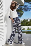 Caroline Biss SS2019 campaign (looks: white jumper, flowerfloral trousers, white sneakers)