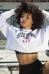 GUESS Sport 2019 campaign (looks: white cropped jumper with slogan)