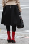 Minsk street fashion. 10/2019 (looks: black midi skirt, black bag, red lowboots, black tights)