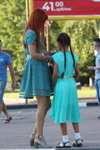 Street fashion. 08/2019 (looks: red hair, turquoise dress, silver sandals)