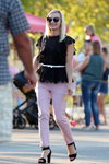 Street fashion. 08/2019 (looks: blond hair, Sunglasses, black top, pink trousers, black sandals)