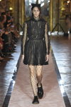 Vittoria Ceretti. Giambattista Valli x H&M show (looks: black pumps, black large mesh tights, black veil)