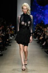 Product of imitation show — MBFW Russia SS2020 (looks: black transparent blouse, black skirt, black sandals, blond hair)