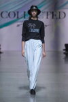 Collected Story show — Riga Fashion Week SS2021 (looks: black jumper with slogan, sky blue trousers, black hat)