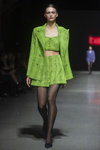 Noname Atelier show — Riga Fashion Week SS2021 (looks: lime checkered skirt suit, black tights, black pumps)