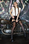 Hosiery photoshoot. Photographer: Sergey Kapitsin (looks: , black stockings with lace top, black ankle boots, black mini skirt, braid)