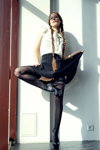 Hosiery photoshoot. Photographer: Sergey Kapitsin (looks: , black stockings with lace top, black ankle boots, black mini skirt, braid)