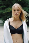Kim van der Laan. Chantelle FW 20/21 lingerie campaign (looks: black bra, blond hair)