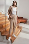 Sandra Najduk. MOHITO Future Classic campaign (looks: nude pantsuit, white top, white sneakers)