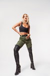 Rita Ora. ShoeDazzle x Rita Ora campaign (looks: black crop top, khaki trousers, black boots, blond hair)