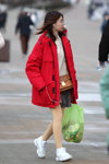 Minsk street fashion. 02/2020 (looks: red jacket, nude tights, white sneakers, grey checkered mini skirt, brown bag)