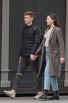 Minsk street fashion. 04/2020 (looks: grey ripped jeans, black quilted jacket, grey sneakers, grey coat, sky blue jeans)