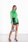 Odi et Amo SS 2021 lookbook (looks: green blouse with jabot, black mini leather skirt, black sandals)