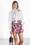 Odi et Amo SS 2021 lookbook (looks: white polka dot blouse, flowerfloral mini multicolored skirt, black bag)