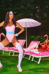 PrettyLittleThing Halloween 2021 lingerie campaign (looks: white overknees, pink closed swimsuit)