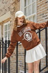 BACK TO COOL. SHEIN campaign (looks: white mini skirt, brown jumper with slogan, white baseball cap)